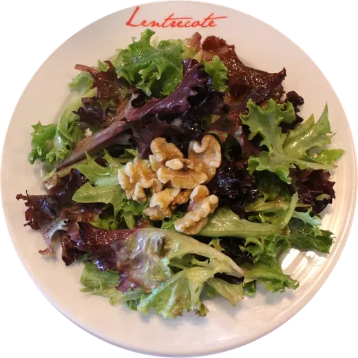 La Salade at Lentrecote: mixed greens with walnuts and house Dijon vinaigrette on a Lentrecote plate