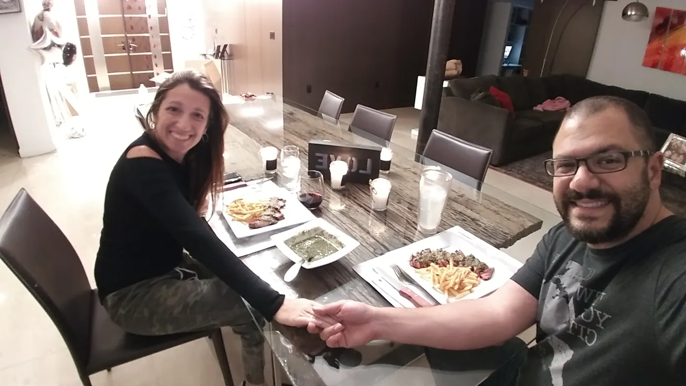 Ronald Szkolnik and his wife at a candlelit anniversary dinner at home with steak frites and the Lentrecote sauce